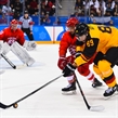 GANGNEUNG, SOUTH KOREA - FEBRUARY 25: Olympic Athletes from Russia's Vyacheslav Voinov #26 and Germany's David Wolf #89 battle for a loose puck during gold medal round action at the PyeongChang 2018 Olympic Winter Games. (Photo by Andrea Cardin/HHOF-IIHF Images)

